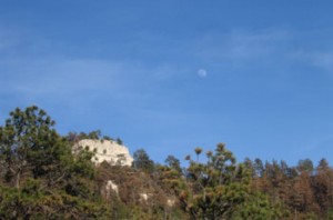 Moon over butte
